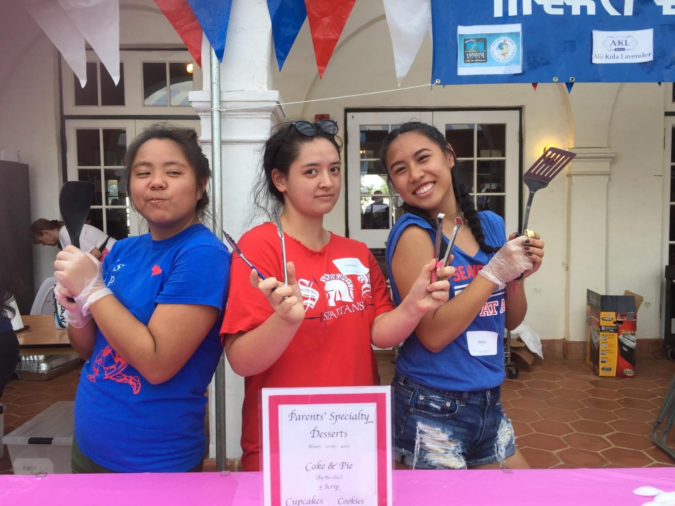 Senior Angela Yasutomi, junior Hiwa Grieg, and junior Melia Fong serve up sweets at La Patisserie.