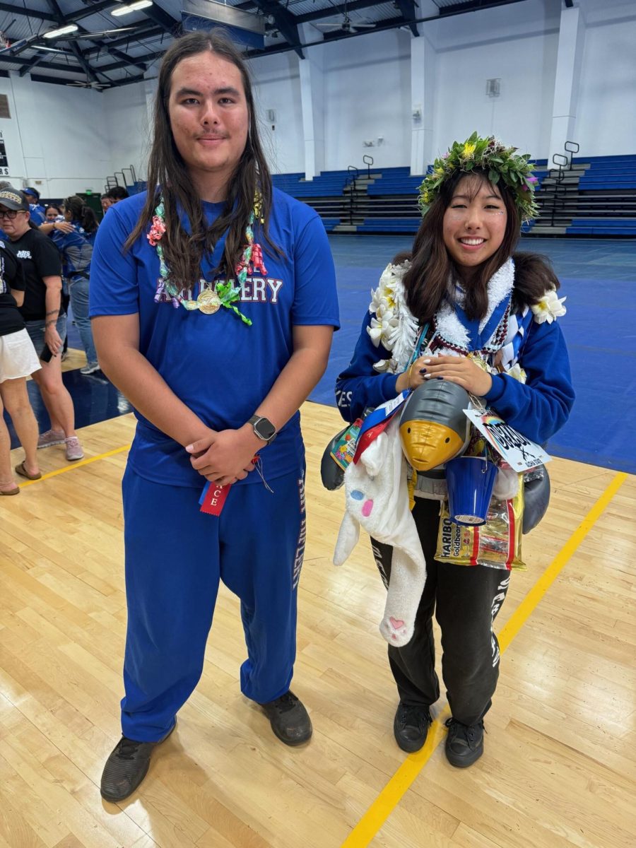 Brandon Yu, left, poses for a photo with the MIL girls champion. 